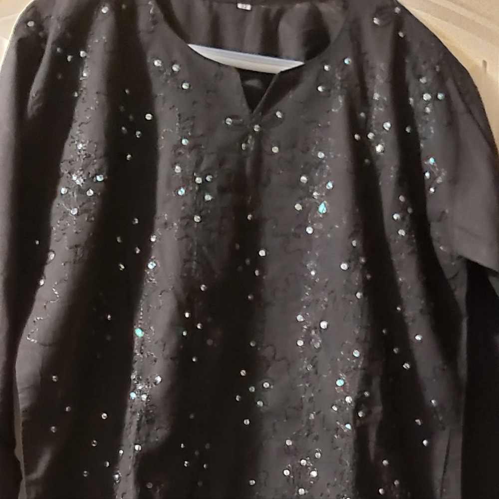 Brand new top/tunic with sequins on front side